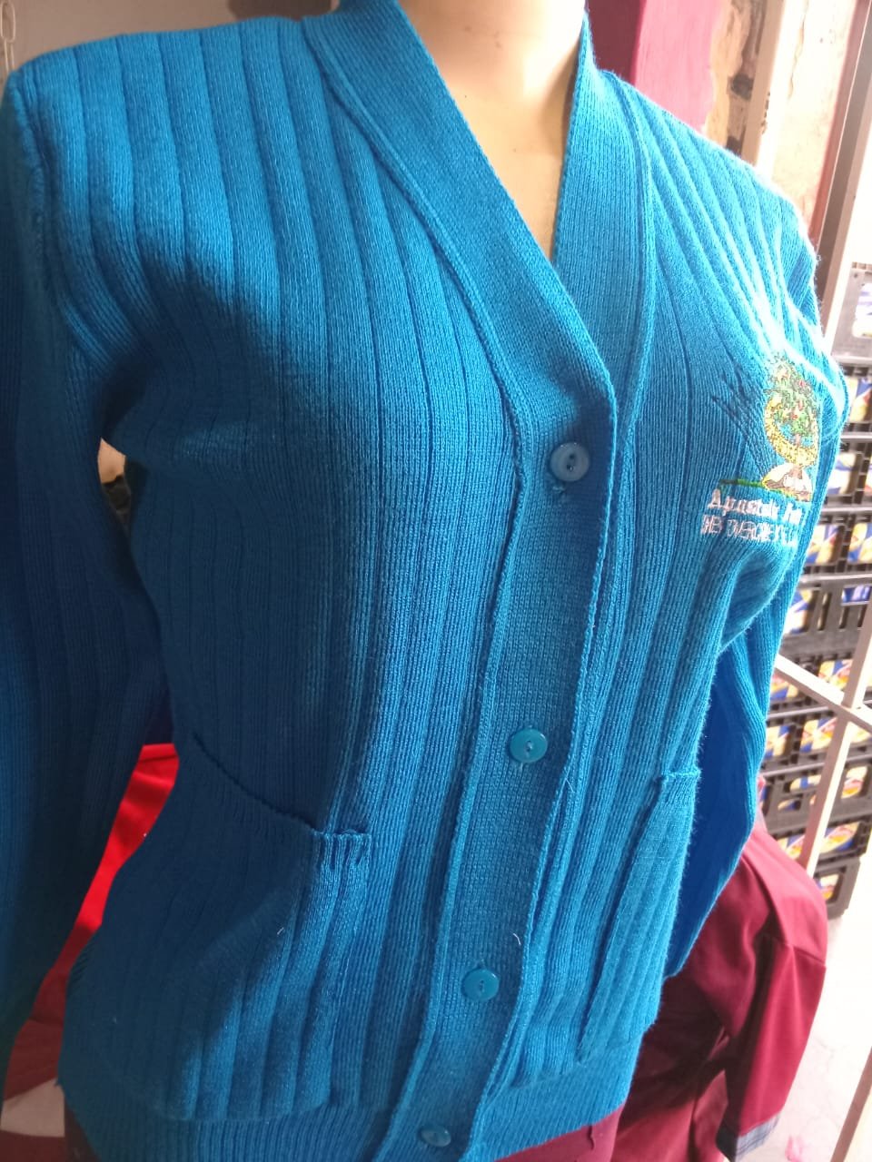 Blue school cardigan with embroidered badge — M2 Embroidery