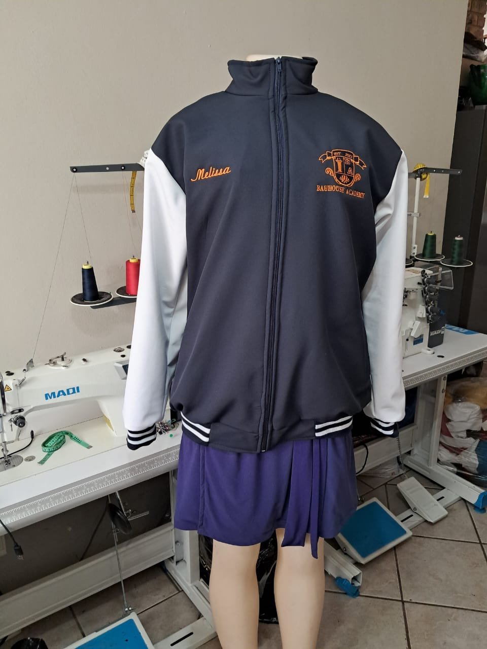 Bauhouse Academy varsity jacket with name embroidery — M2 Embroidery
